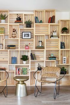 a living room filled with lots of wooden shelves