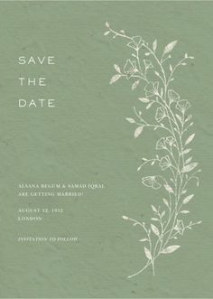 a green save the date card with white flowers and leaves on it's side