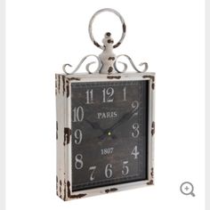 an old fashioned clock with the number one on it's face and numbers painted white