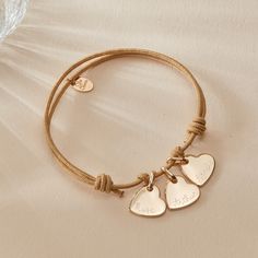 Wear your heart on your sleeve with our Personalized Heart Name Bracelet. Personalize the front and reverse of the mini heart charm with a hand engraved name, date or word, to pair alongside a vibrant braid color of your choice.&nbsp;18K Champagne Gold Plated, 925 Sterling Silver or 18K Rose Gold PlatedMini Flat Heart: 0.4x0.4Braid made of a durable, colorfast polyesterFully adjustable sliding knot fasteningHand-engraved in our Paris workshopSent with love in a complimentary gift boxAny slig Heart On Your Sleeve, Mini Charm, Sliding Knot, Name Bracelet, Mini Heart, Heart On, Champagne Gold, Hand Engraving, 18k Rose Gold