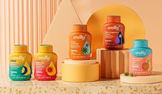 several bottles of baby formulas on a table with an orange wall in the background