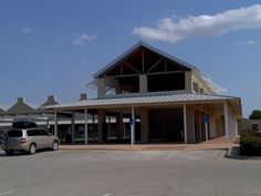 an empty parking lot in front of a building