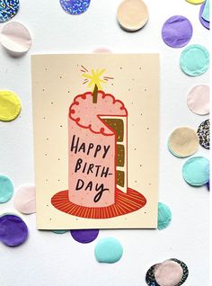 a card with a birthday cake on it surrounded by confetti and paper circles