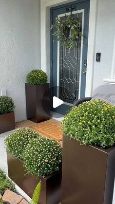 some planters that are sitting in front of a door