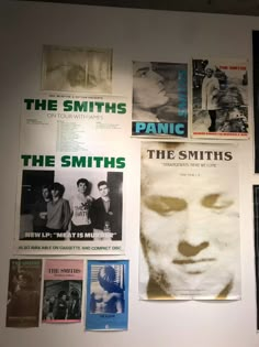 the smiths posters are hanging on the wall