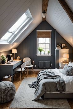 an attic bedroom with gray walls and wooden floors