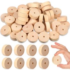 several wooden discs are shown with one hand reaching for them