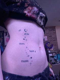 a woman's stomach with the words all of the stars have a reason written on it