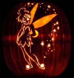 a carved pumpkin with an image of tinkerbell on it