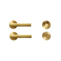 three brass handles and two knobs on a white background