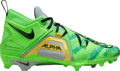 a pair of green and black shoes with the word alpa on it's soles