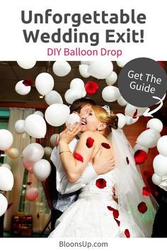 the bride and groom are kissing under white balloons with red confetti on them