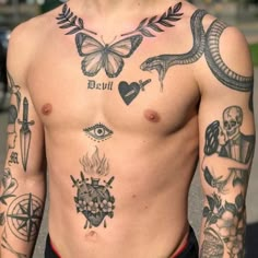 a man with many tattoos on his chest