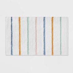 a white towel with multicolored stripes on it