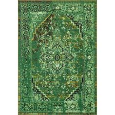 a green rug with an ornate design