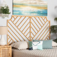 a bedroom with a bed, nightstand and painting on the wall above it that is decorated in bamboo