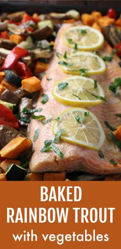 baked rainbow trout with vegetables and lemons on a sheet pan for dinner or side dish