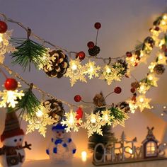 christmas lights and decorations are hanging from the ceiling