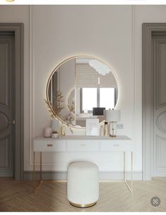 a white vanity with a round mirror and stool in front of it on a wooden floor