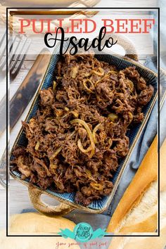 pulled beef salad in a serving dish with bread on the side