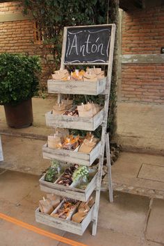 a sign that is sitting on the side of a building with some food in it