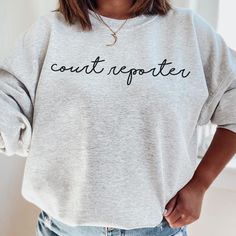 This court reporter crewneck sweatshirt is perfect for any court reporter! Style this stenographer sweatshirt with some jeans for an easy, cute outfit! This classic unisex heavy blend crewneck sweatshirt is pure comfort. Fuzzy inside makes it oh so cozy! ☻ THIS IS A PHYSICAL ITEM! ☻ * 50% cotton & 50% polyester * Adult Unisex * Medium weight fabric (8.0 oz/yd²) * Gildan brand * Crew Neck ☻ SIZING ☻ PLEASE CHECK THE SIZE CHART IMAGE TO HELP YOU CHOOSE THE BEST FIT! WE DO NOT ACCEPT EXCHANGES, RET Nurse Style, Court Reporter, Emergency Nurse, Court Reporting, Senior Shirts, Emergency Nursing, Senior Gifts, Preppy Clothes, Sweatshirt Crewneck