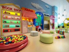 the children's playroom is brightly colored and has lots of toys in it