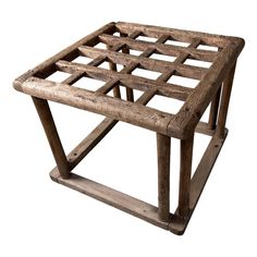 an old wooden table that has been turned into a side table with lattices on it