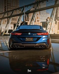 the rear end of a blue bmw car