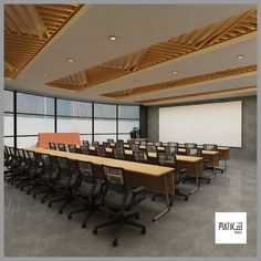 an empty conference room with wooden tables and chairs