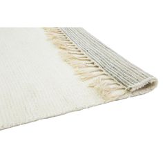 a white rug with fringes on the top and bottom part, in front of a white background