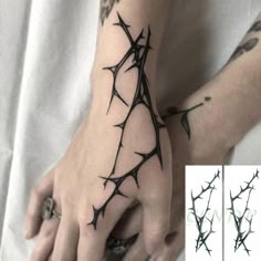 barbed wire tattoo on the left hand