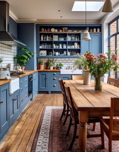 a kitchen with blue cabinets and wooden floors