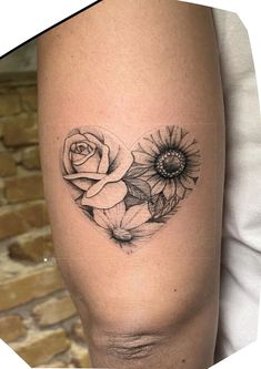 a woman's thigh with flowers on it