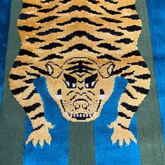 an animal rug with a tiger on it