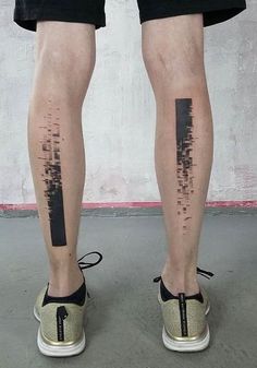 a person with black ink on their legs and the leg is covered in an abstract pattern