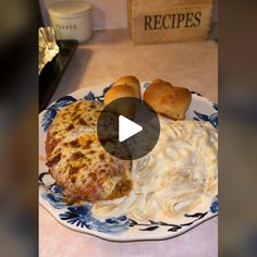 a plate with some food on it and bread in the middle, sitting on a table