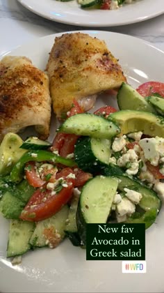two white plates topped with chicken, cucumber and tomato salad next to each other