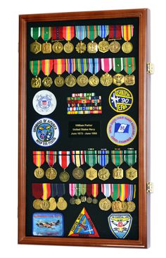 a display case with medals and badges on it