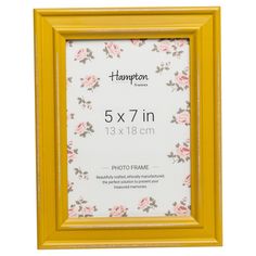 a yellow frame with pink flowers on it