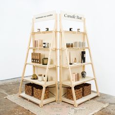 two wooden shelves with baskets and bottles on them