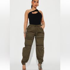 Brand New Stretchy Olive Green Olive Green Cargo Outfits Women, Green Cargo Outfits Women, Baggies Outfit, Olive Green Cargo Pants Outfit, Baggie Pants, Cargo Outfits Women, Green Cargo Pants Outfit, Turquoise Jumpsuit, Black Sequin Jumpsuit