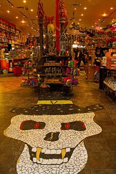 an image of a store that is decorated with mosaic tiles and skulls on the floor