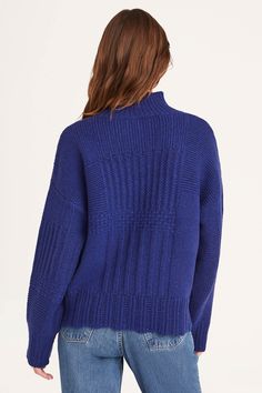 A timeless turtle neck sweater featuring our signature patchwork knit pattern, the VALAIS has a boxy fit and is crafted in a wool nylon blend. With chunky rib knit neck, cuffs and hem. Blue Turtleneck Sweater With Ribbed Cuffs, Blue Funnel Neck Sweater With Ribbed Cuffs, Blue Turtleneck For Winter Layering, Blue Knit High Neck Sweater, Blue Chunky Knit Turtleneck Sweater, Blue Funnel Neck Sweater For Layering, Blue Winter Turtleneck With Ribbed Cuffs, Blue Ribbed Cuff Turtleneck For Winter, Blue Ribbed Cuffs Turtleneck For Winter