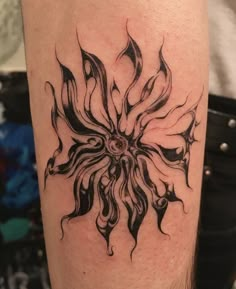 a black and white tattoo design on the leg