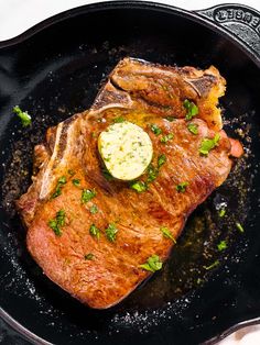 a piece of meat in a skillet on a table