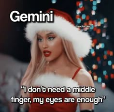 a woman wearing a santa hat with the caption'i don't need a middle finger, my eyes are enough '