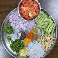 a metal plate topped with different types of food