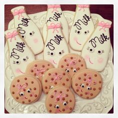 decorated cookies are arranged on a white plate