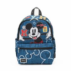 Take your stuff with you with this colorful nylon backpack by WondaPop featuring the Walt Disney's classic Mickey Mouse born October 1, 1928. Mickey looks happy on the front of the bag with No. 1 and Mickey symbols on the front pocket. "Mickey Mouse" is boldly displayed across the top of the bag. The day pack is covered with No. 1 and 1928 and it has two side pockets. The back of the bag shows Mickey looking very proud. The pack features a huge main compartment with two zipper pulls, two side po Travel Socks, Disney Logo, Classic Mickey Mouse, Disney Monsters, Plush Backpack, Disney Bag, Girls Handbags, Disney Theme Parks, October 1